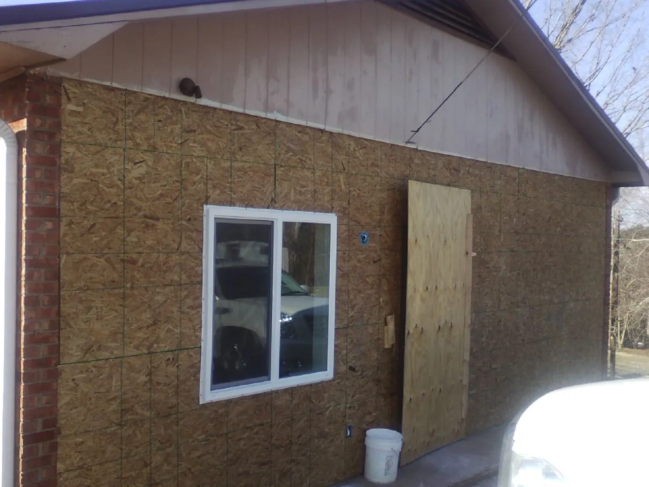 OSB sheathing on a garage addition wall before siding in Fingal